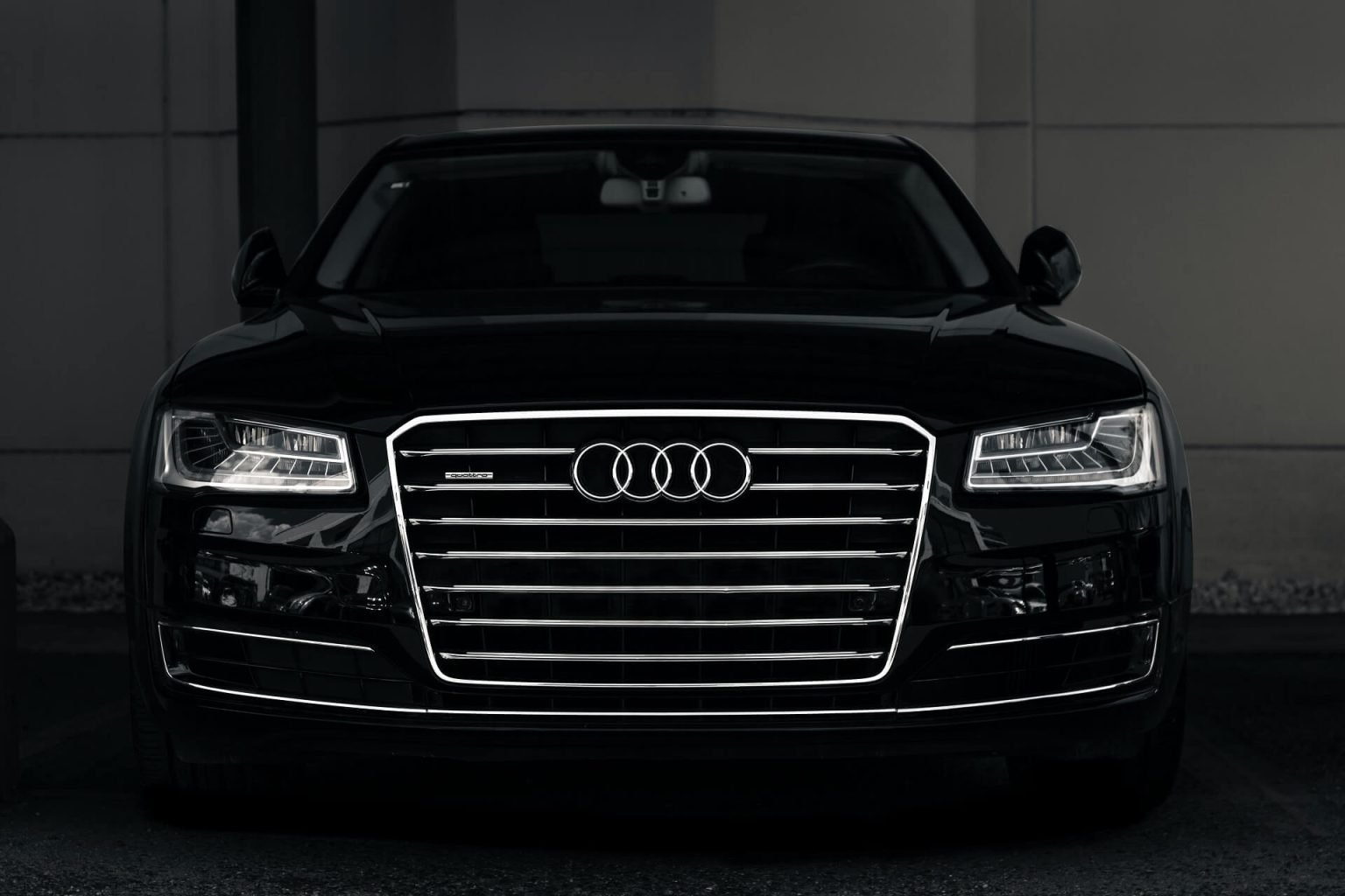 Front view of a black Audi parked indoors