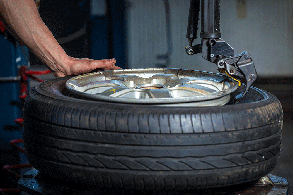 Technician working on an alloy wheel during rim repair in Dubai