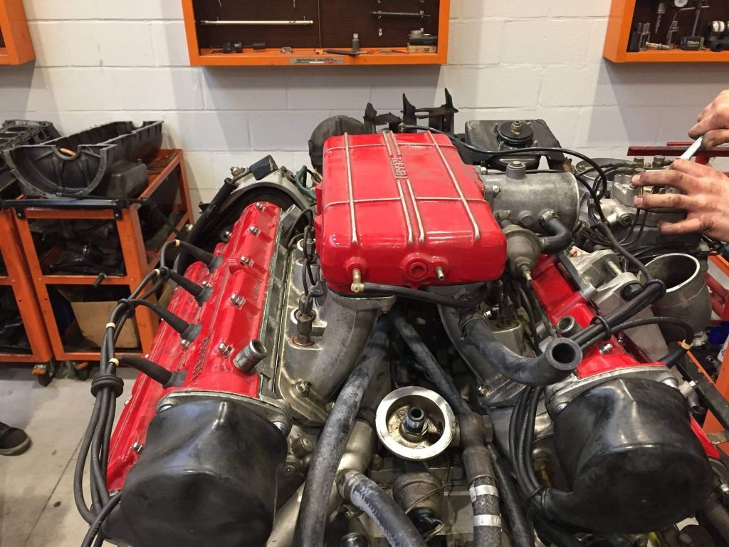 Ferrari engine assembly being worked on in a workshop