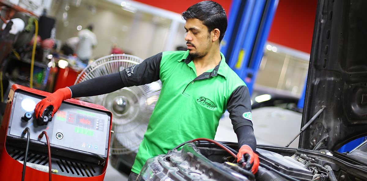 Technician testing a vehicle air-conditioning system in Dubai