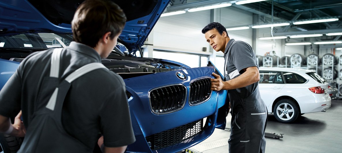 BMW body damage inspection inside a Dubai body shop