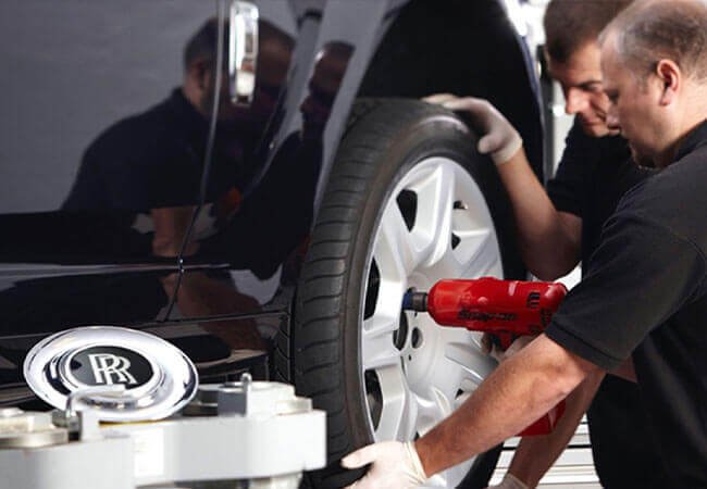 Rolls-Royce tyre inspection at a Dubai workshop