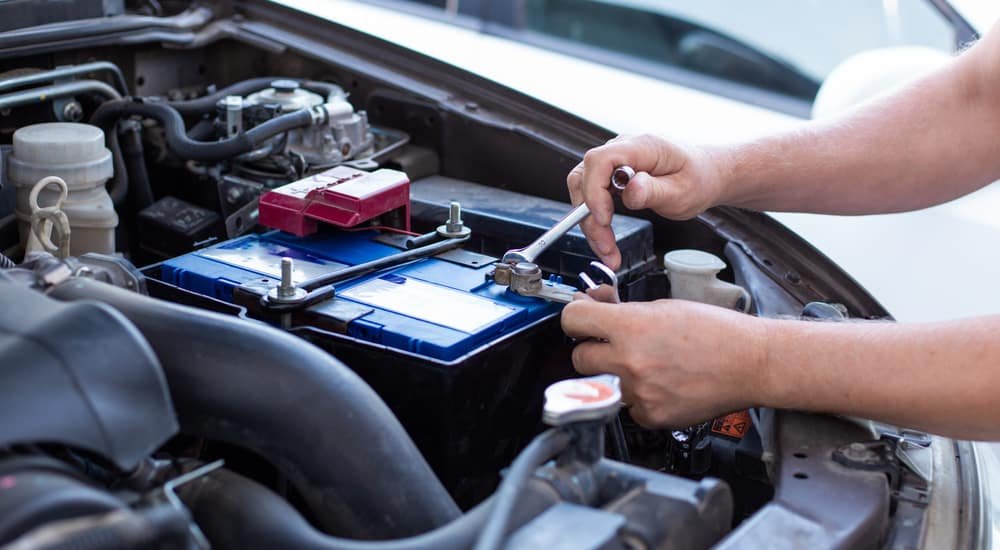 Technician testing a Dodge battery and charging system