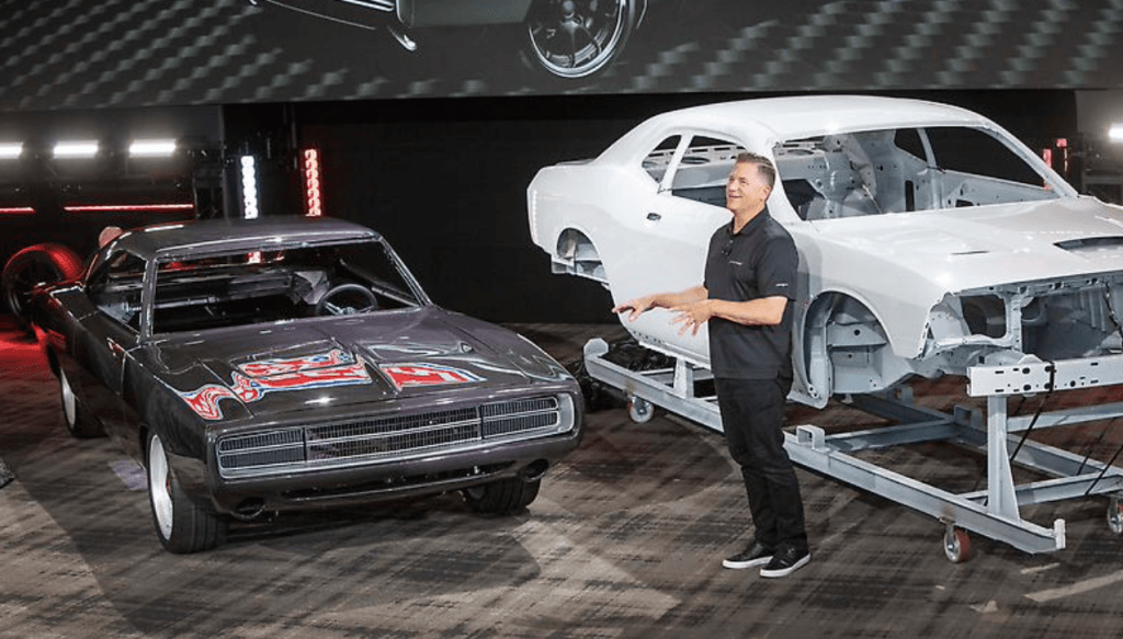 Technician inspecting Dodge body-panel alignment and paint damage