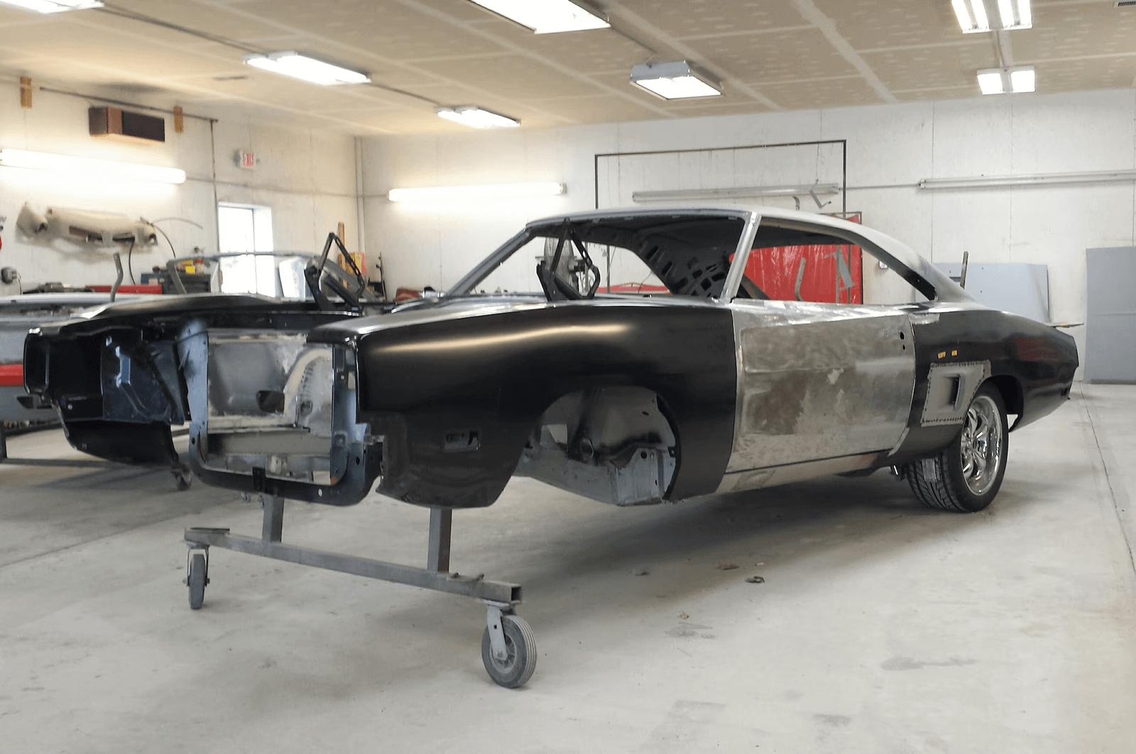 Dodge body panel inspected for repair in a Dubai workshop