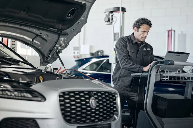 Jaguar undergoing dent repair inspection in Dubai