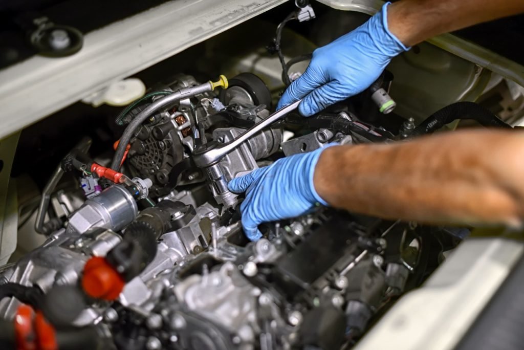 Mechanic inspecting a Volkswagen engine in Dubai
