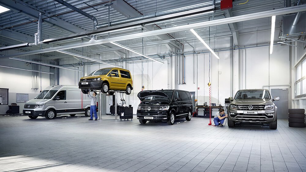 Technician inspecting a Volkswagen in a Dubai workshop