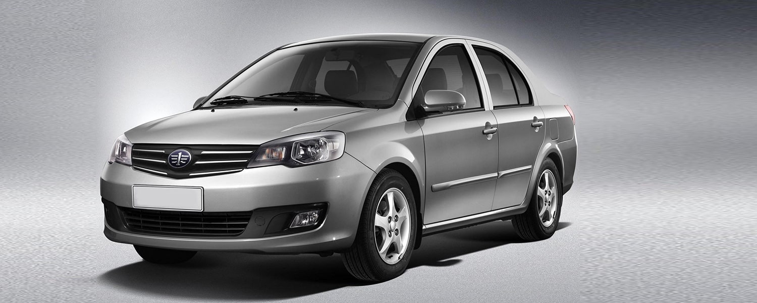 Silver FAW vehicle prepared for repair assessment in Dubai