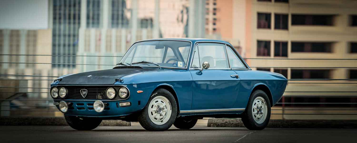 Blue Lancia prepared for a repair assessment in Dubai