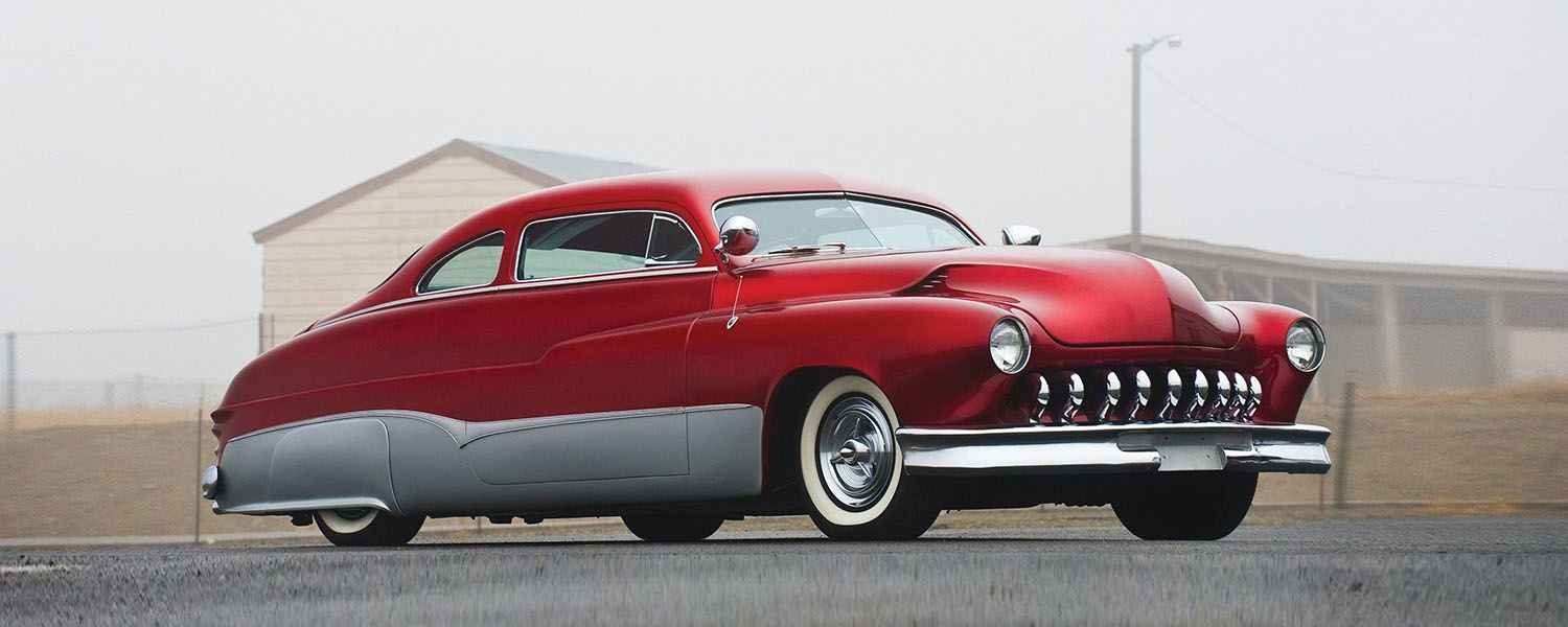 Classic red Mercury coupe parked outdoors