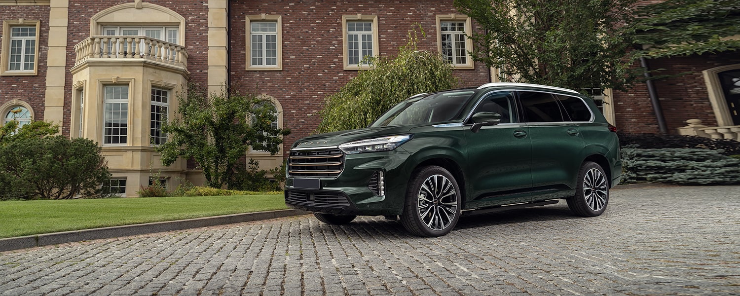 Green EXEED vehicle prepared for diagnostic assessment in Dubai