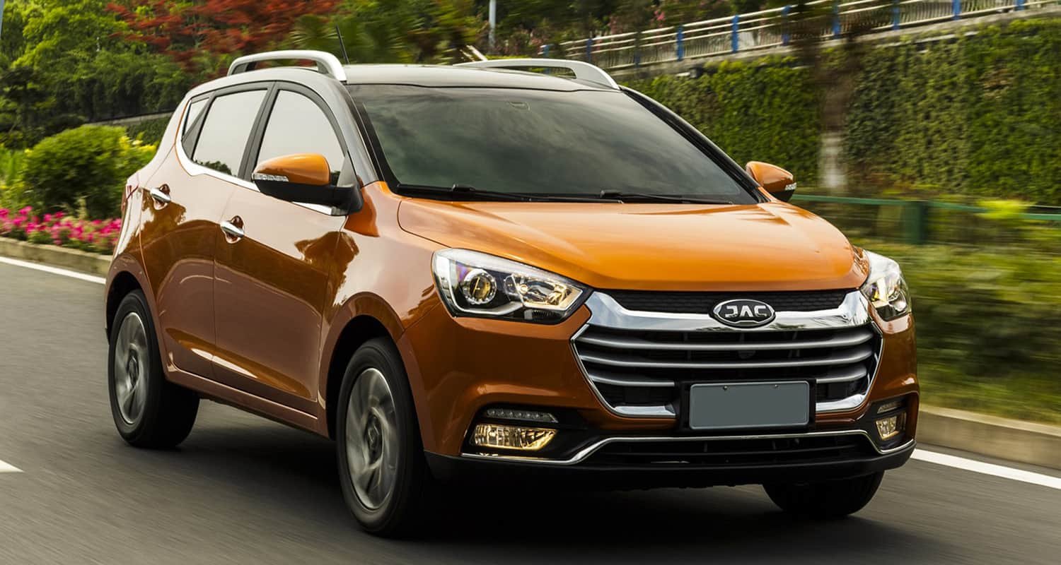Orange JAC SUV on a road