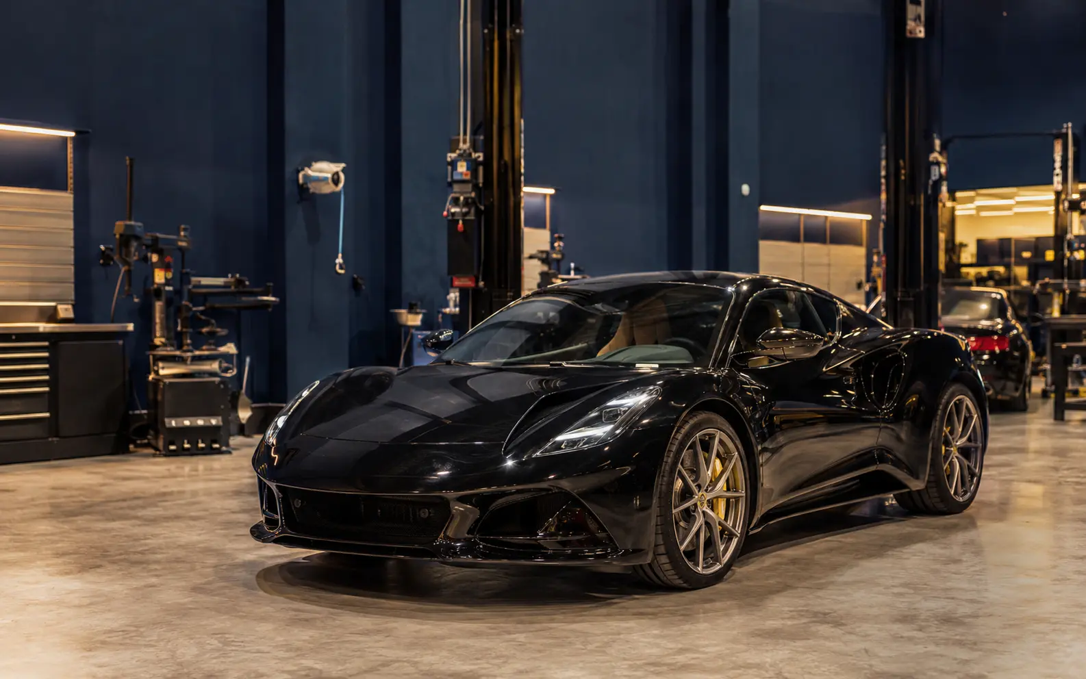Current Lotus Emira inside a modern independent Dubai workshop