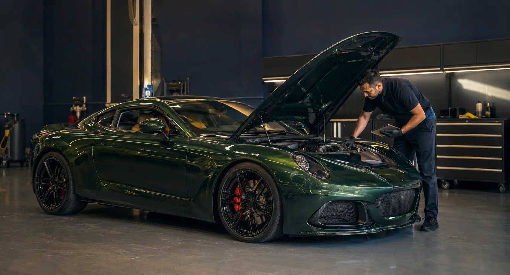 Performance car with its engine bay open during a workshop check