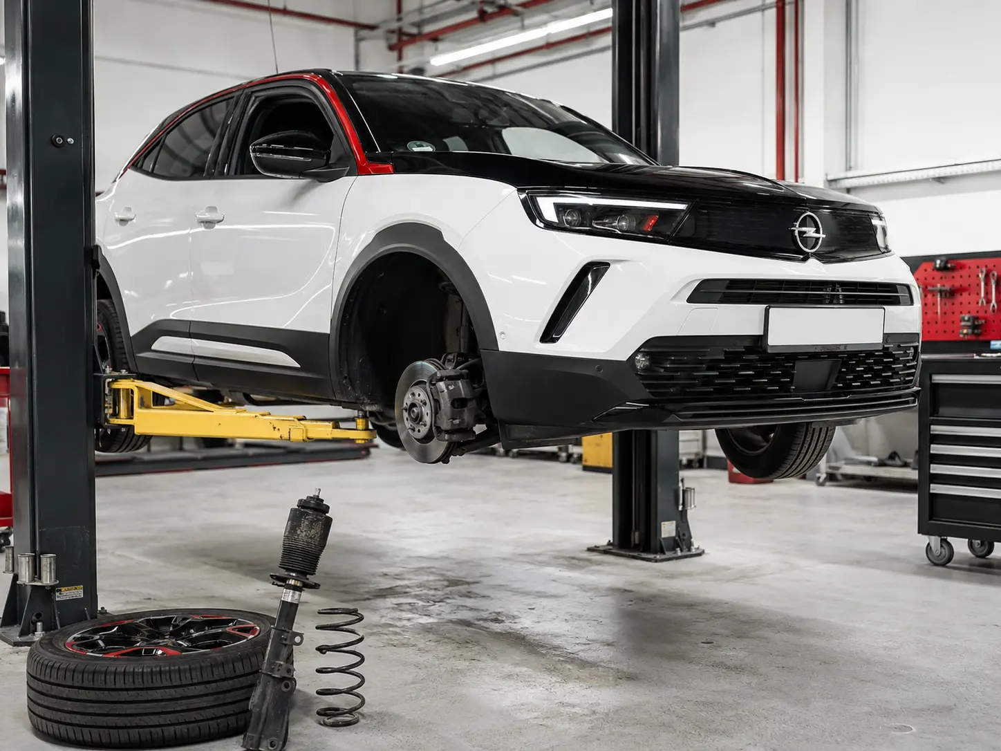 Recent Opel Mokka brake and suspension inspection on a workshop lift