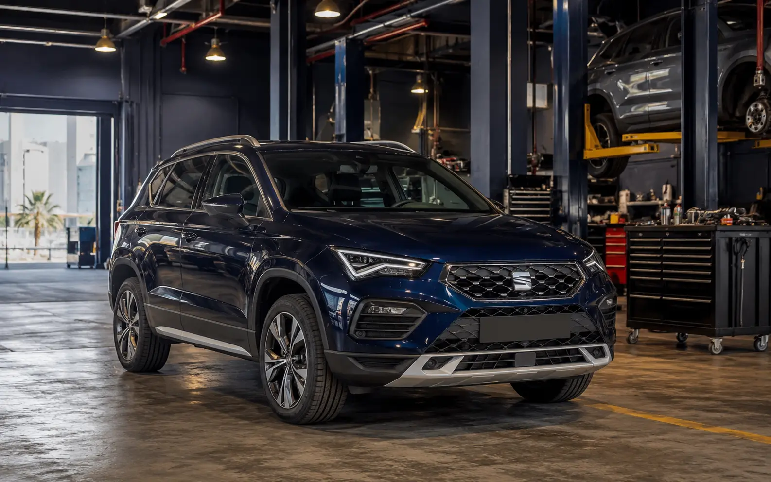 Current-generation SEAT Ateca inside a modern independent Dubai workshop